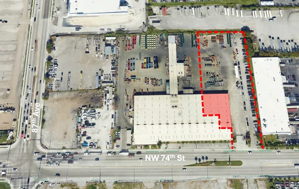 Labeled aerial of 8505 NW 74th Street showing the building and yard parcel outlined between NW 74th Street and 87th Avenue
