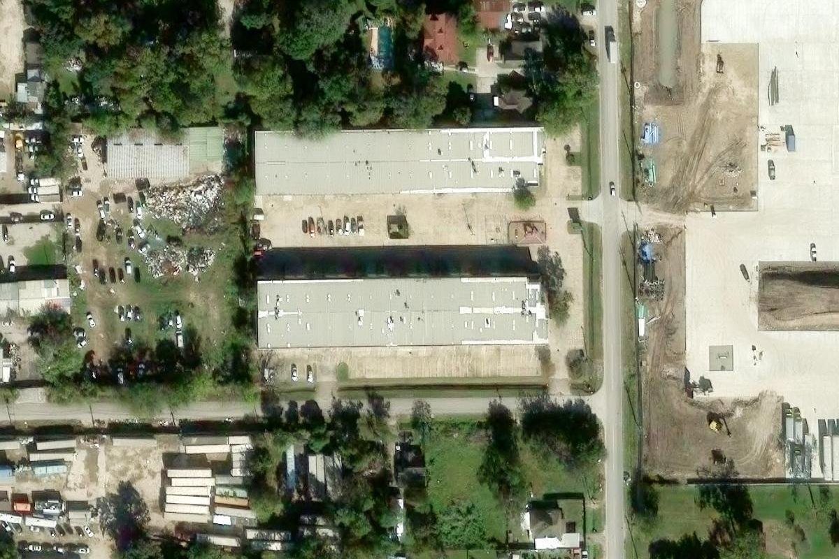 Aerial view of 600 Sam Street — the north and south buildings either side of a shared drive aisle, Stuebner Airline Road to the east.